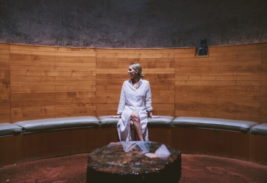 woman sitting in the Crystal Grotto