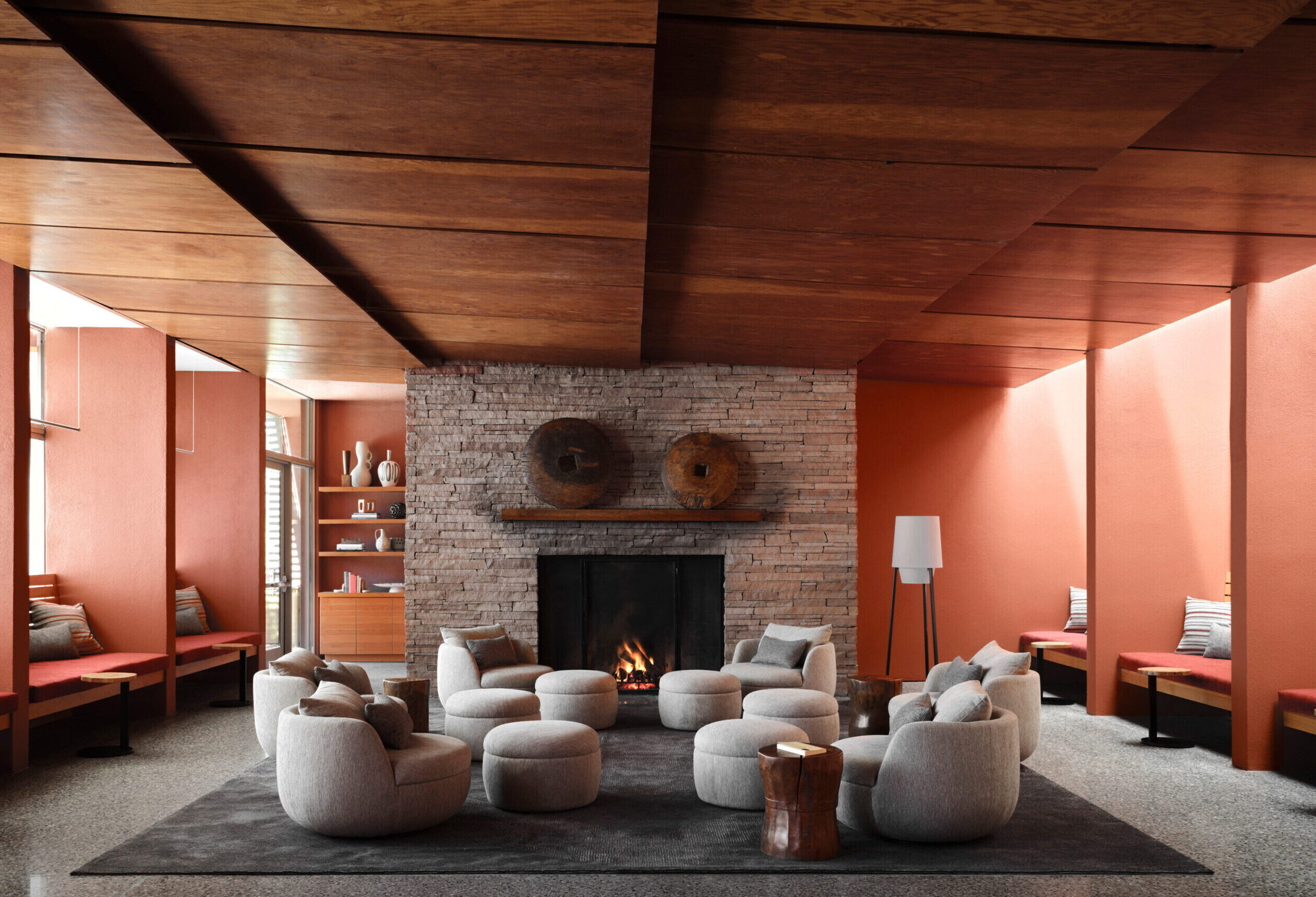 Living room with fireplace and comfortable lounge chairs at our destination spa in Sedona, AZ
