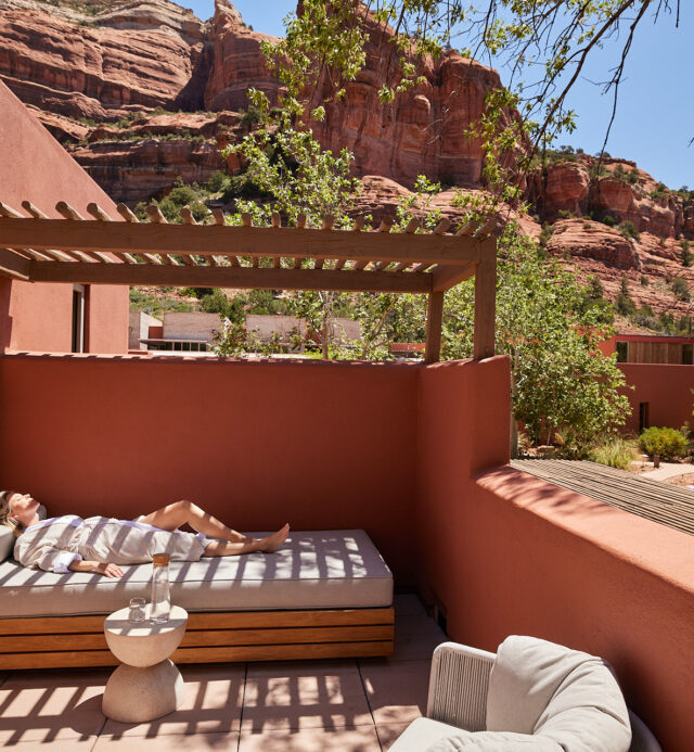 Woman lounging on Private Terrace at Mii amo