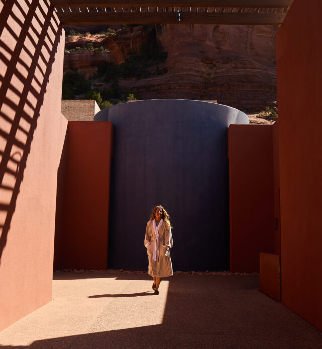 woman walking at entrance to Mii amo