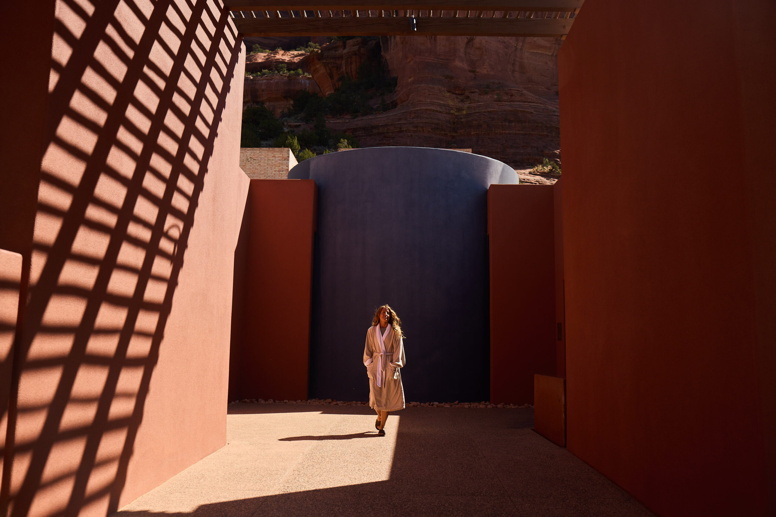 woman walking at entrance to Mii amo