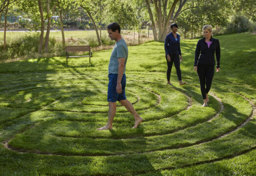 guests walking grass spiral labyrinth