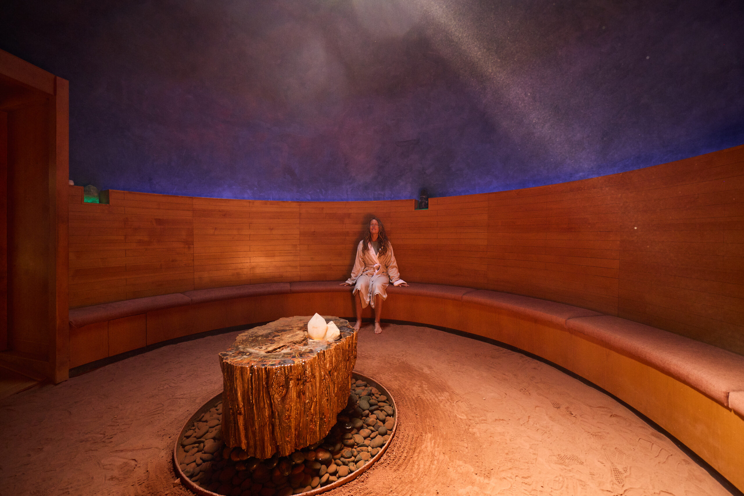 woman in crystal grotto meditating
